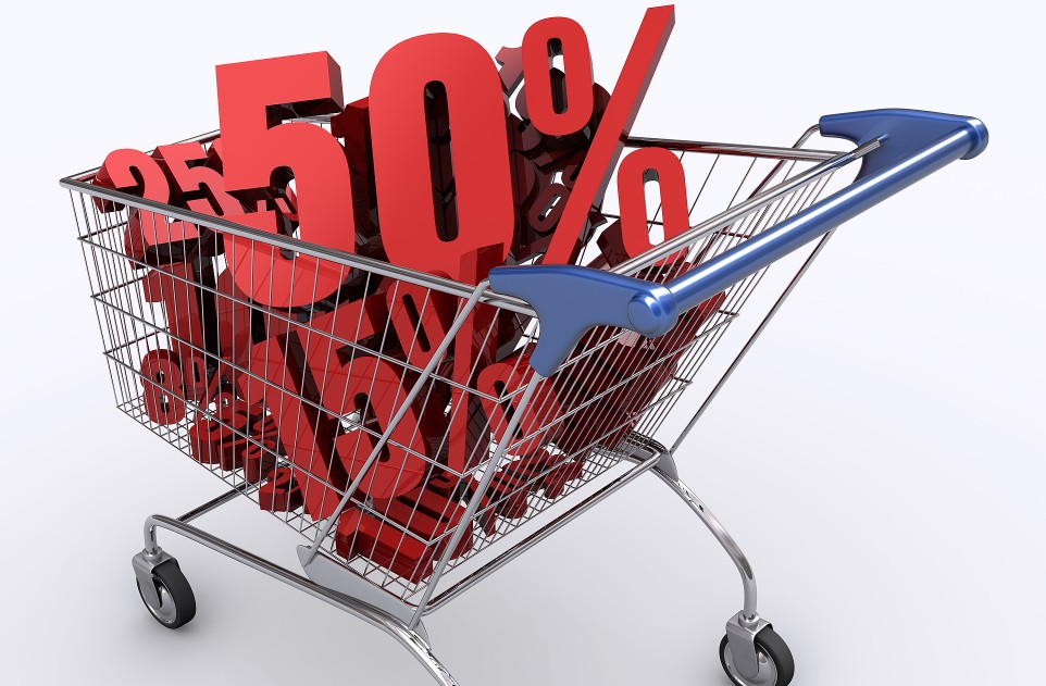 Shopping cart full of percentage. Concept of discount.